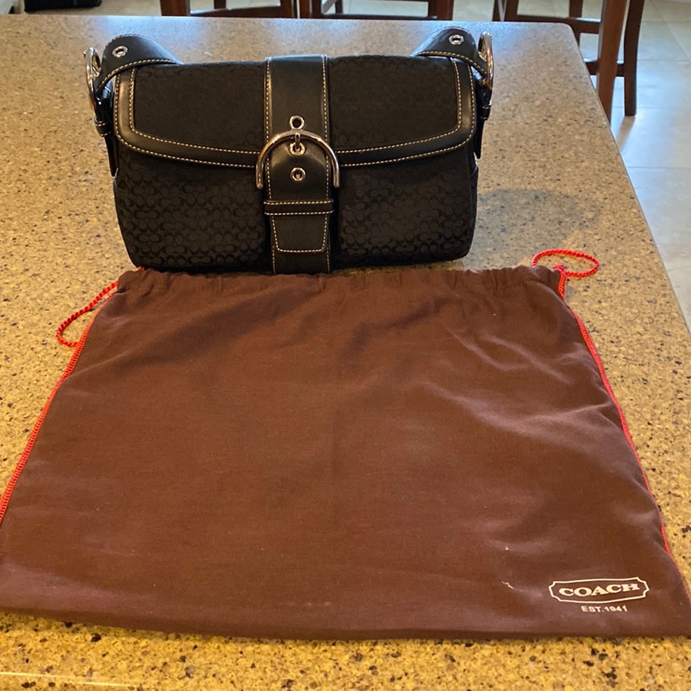 Like new Coach purse that comes from a smoke free home.